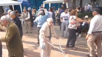 An Elderly Man Throws Crutches Away to Dance