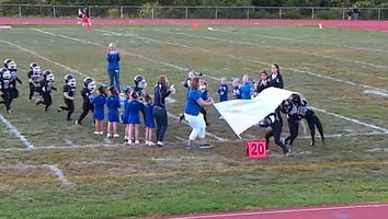 This Youth Football Team Running Through a Banner Is the Cutest Fail You'll See All Week