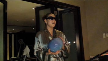 Mariah Carey Proves She Can Still Hit Those High Notes - and Clean House -- in Bizarre Video