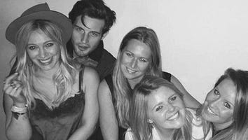 Hilary Duff Sparks Romance Rumors by Sitting on Co-Star's Lap