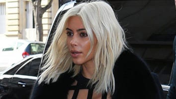 Kim Kardashian Shows Off New 'Do and Serious Curves in Bondage Dress