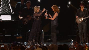 Kelly Clarkson Tells ACMs Audience to 'Suck It' While Bragging on In-Law Reba McEntire