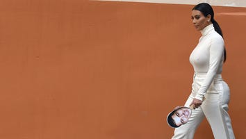 Kim Kardashian Carries Cutout of Brother Through Armenia, Has North West Baptized in Jerusalem Church