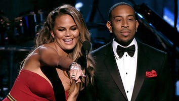 Chrissy Teigen's Dress Trips Up Audience Member at Billboard Music Awards