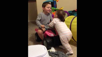 This Little Boy Teaching His Baby Sister How to Walk Is Guaranteed to Put a Smile on Your Face