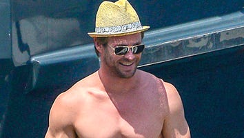These Pictures of Shirtless Chris Hemsworth Paddle Boarding Will Be the Highlight of Your Week