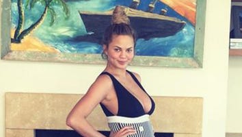 Chrissy Teigen Flaunts Her Baby Bump In A Sexy Swimsuit!