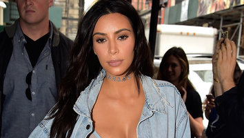 Kim Kardashian Wears Thigh-High Boots With Bra Top and Yeezy Jean Jacket in NYC