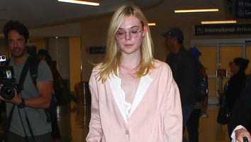 Elle Fanning Goes Barefoot in Oversized Pantsuit at LAX: See the Strange Pic