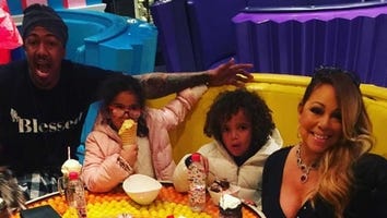 Nick Cannon Joins Mariah Carey and Their Twins On Stage During Holiday Performance