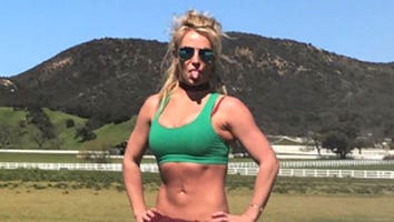 Britney Spears Flaunts Bikini Bod as She Rolls Around in the Sand: 'TGIF'