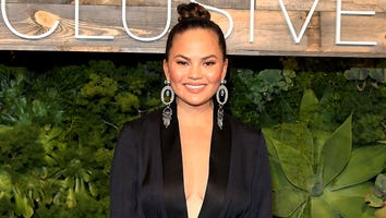 Chrissy Teigen Wears Nothing But Heels and a Headdress in Bed -- See the Pics!