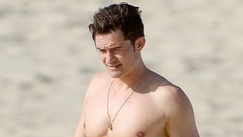 Shirtless Orlando Bloom Goes Paddle Boarding With Model Kristy Hinze in France