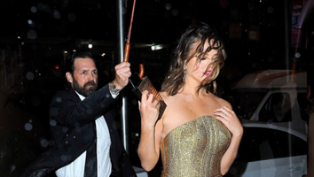 Chrissy Teigen Fights Her Way Through a Storm in a Gown and Still Looks Totally Glam -- See the Proof