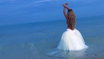 Kim Zolciak Celebrates Her 2.5 Million Followers With a Topless Ocean Pic