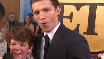EXCLUSIVE: Tom Holland's Adorable Little Brother Crashes His Red Carpet Interview at 'Spider-Man' Premiere