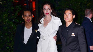 Angelina Jolie Poses With Sons Maddox and Pax at Film After Party in Trench Coat Dress: Pics
