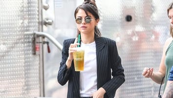 Selena Gomez Continues Chic Streak in NYC in Pinstripe Trench Coat and Flared Jeans -- See the Trendy Look!
