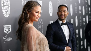 Chrissy Teigen Glows in a Stunning Silver, Feather-Covered Maternity Red Carpet Dress