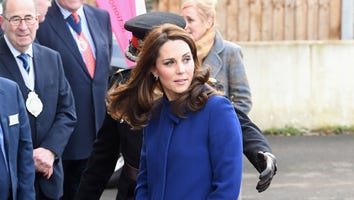 Pregnant Kate Middleton Pairs Royal Blue Coat With High Heels as She Returns Home to England