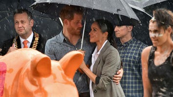 These Pics of Meghan Markle and Prince Harry Cuddling in the Rain Prove True Love Exists
