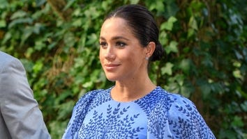 Meghan Markle Cradles Baby Bump While Joking About the 'Embryonic Kicking of Feminism'