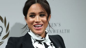Meghan Markle Rocks Floral Mini-Dress While Cradling Baby Bump at Women's Day Event