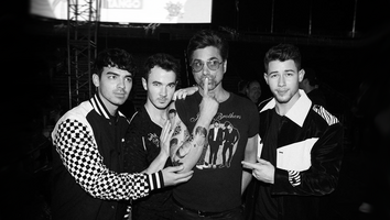 John Stamos Sports Jonas Brothers Tattoo as He Poses With the Band
