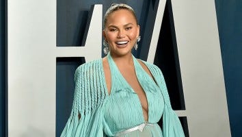 Chrissy Teigen Poses Topless After Having Her Breast Implants Removed