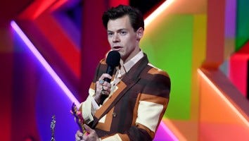 Harry Styles Accessorizes Retro Gucci Suit With Stylish Handbag at 2021 BRIT Awards