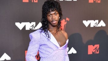 Lil Nas X Teases 'Sexy' 2021 MTV VMAs Performance While Slaying Red Carpet In a Purple Cape (Exclusive)