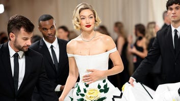 Watch Gigi Hadid Require Six Handlers to Make It Up the Met Gala Steps
