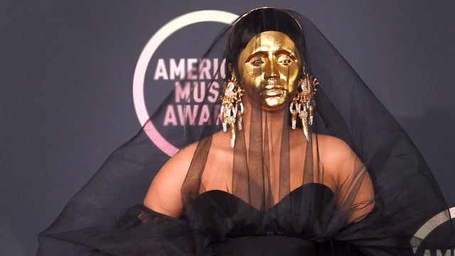 AMAs: Cardi B Sports a Gold Mask and Black Veil on the Red Carpet