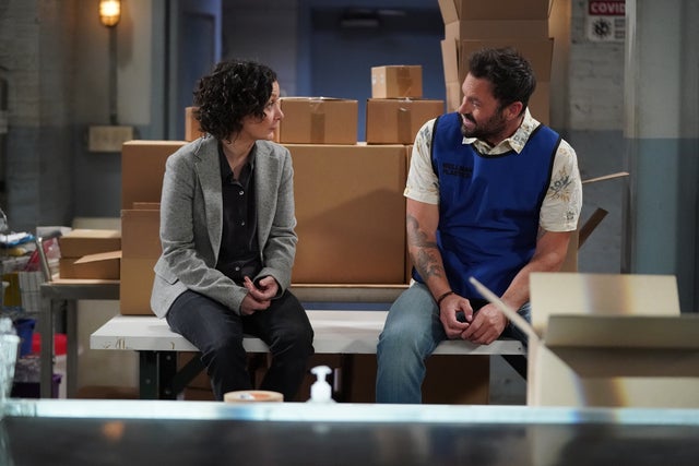 Sara Gilbert and Brian Austin Green on The Conners