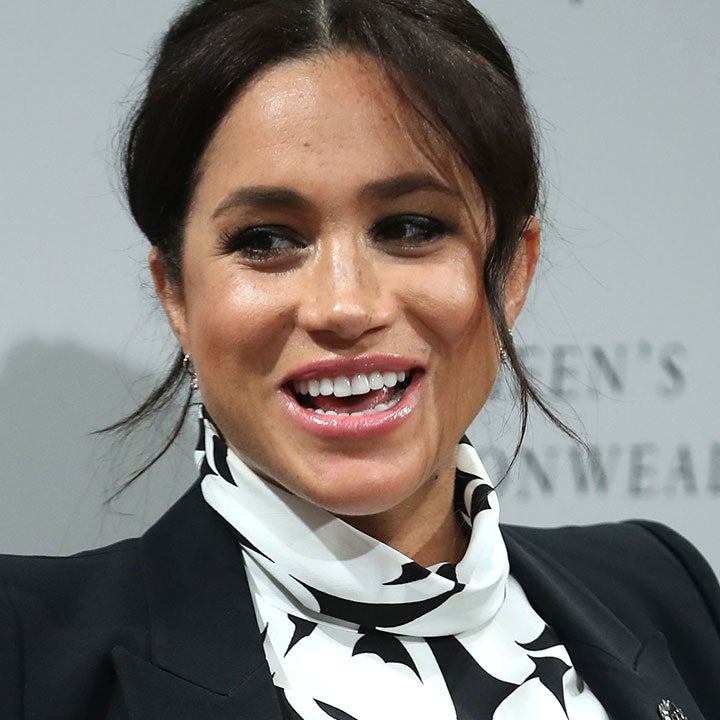 Meghan Markle Rocks Floral Mini-Dress While Cradling Baby Bump at Women's Day Event