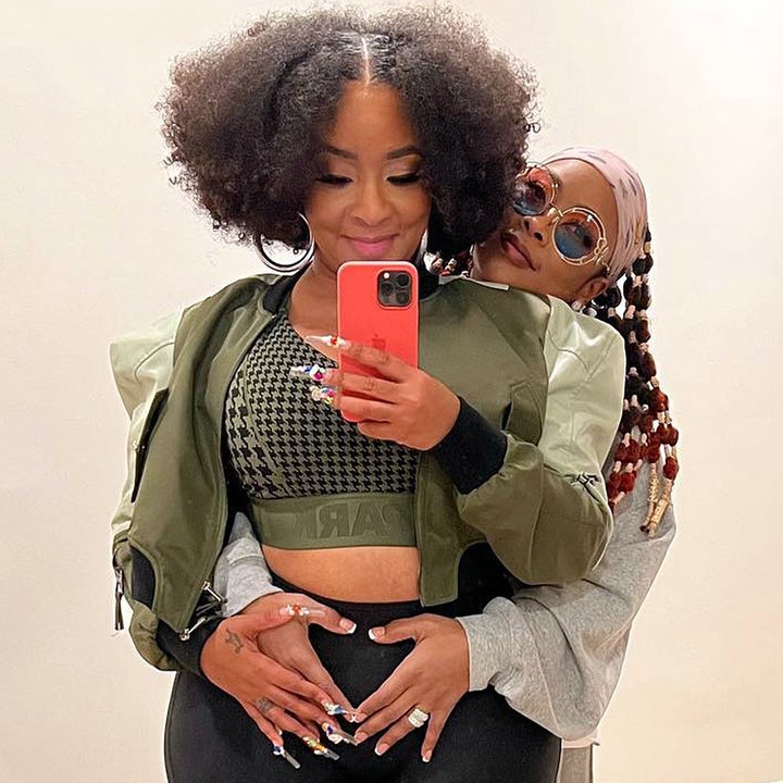 Da Brat and Fiancé Jesseca Dupart Snuggle Up in Pics to Announce They're 'Extending the Family'