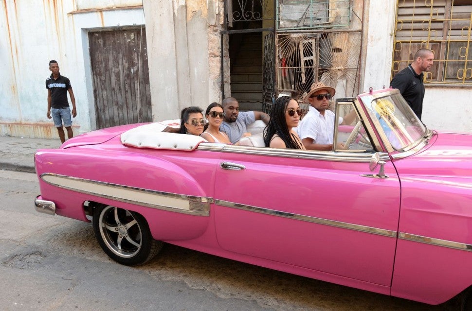 Kim And Kourtney Kardashian Flaunt Their Slim Figures In Cuba See The Pics Entertainment Tonight Kim kardashian wore a skintight white dress to frolic on the playground with her sister kourtney and their kids. kim and kourtney kardashian flaunt