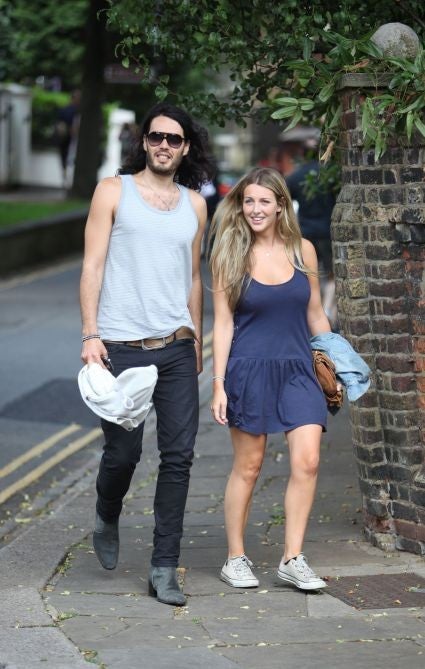 Russell Brand enjoys a relaxing day out with wife Laura and dog Bear