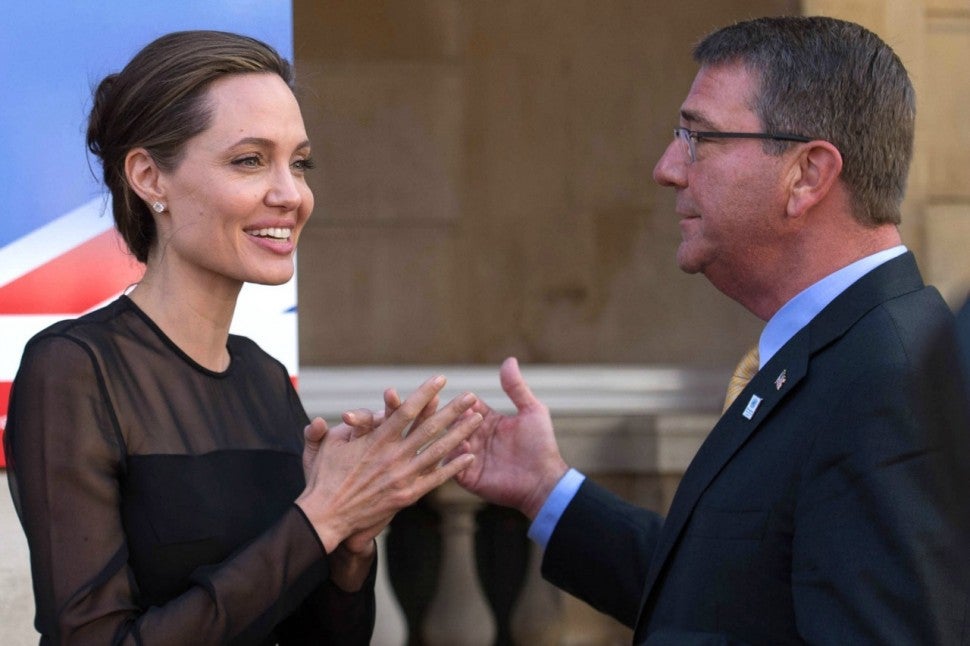 Angelina Jolie Slips on Pumps and Keeps It Classy in Black Midi Dress –  Footwear News