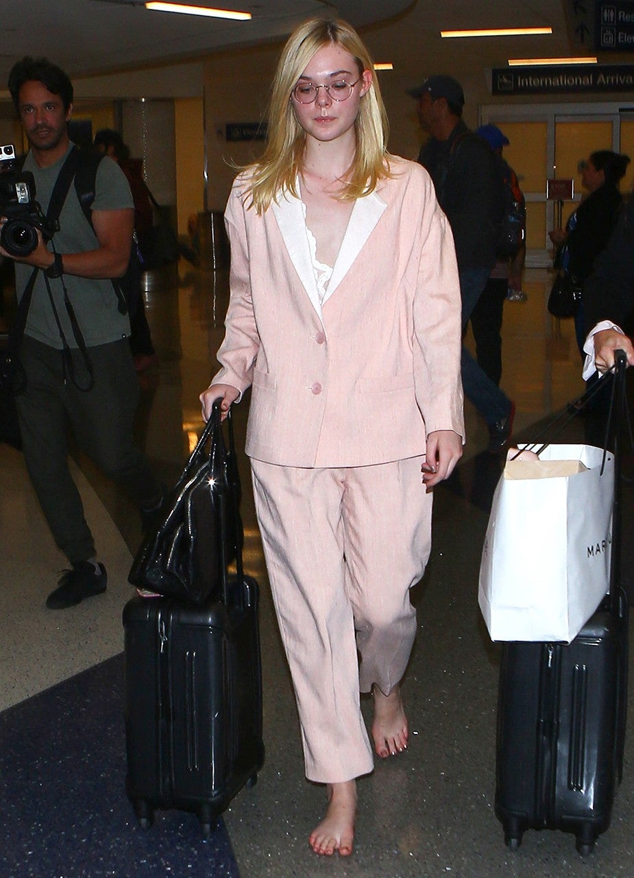 Elle Fanning Goes Barefoot in Oversized Pantsuit at LAX: See the