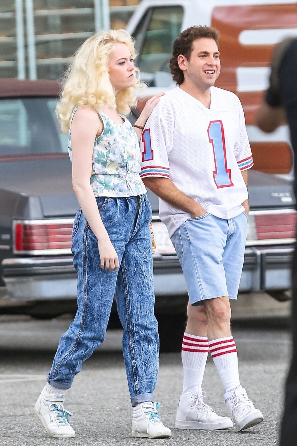 Actors Emma Stone and Jonah Hill take it back to the 80's while filming their upcoming Netflix series 'Maniac' in New York City. A slimmed down Jonah was sporting a sweet mullet on set.