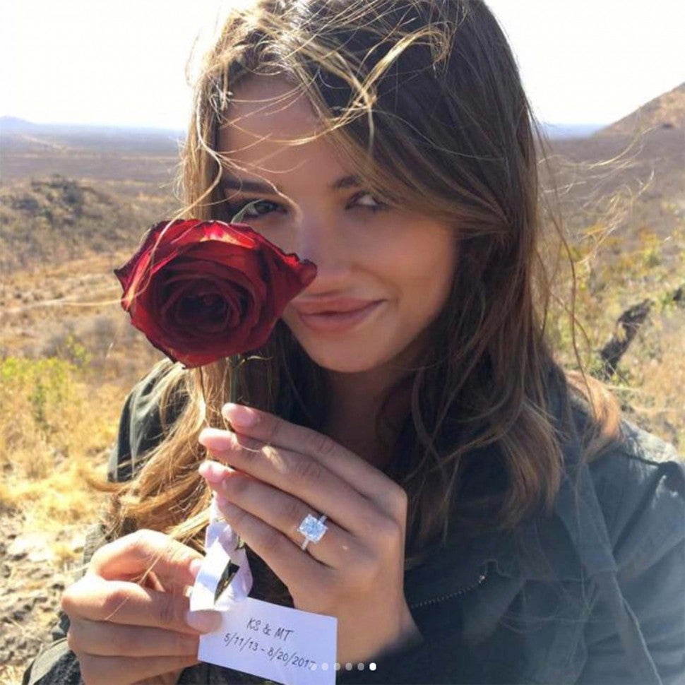 Keleigh Sperry showing off her engagement ring and rose