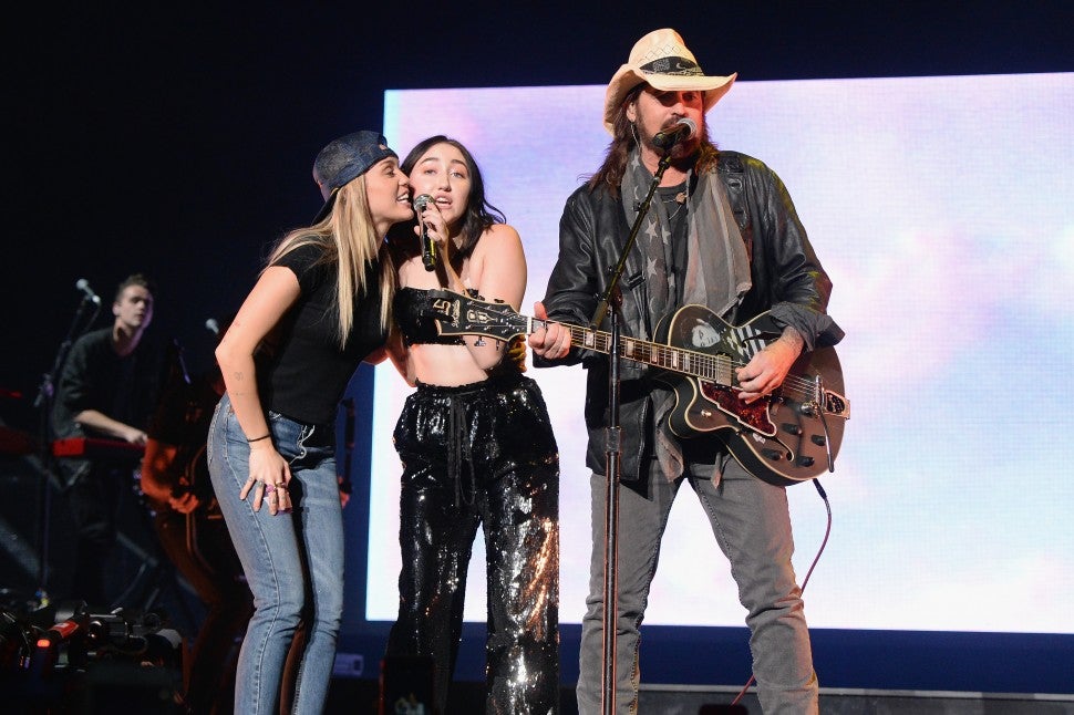 Miley Cyrus, Noah Cyrus, and Billy Ray Cyrus perform together