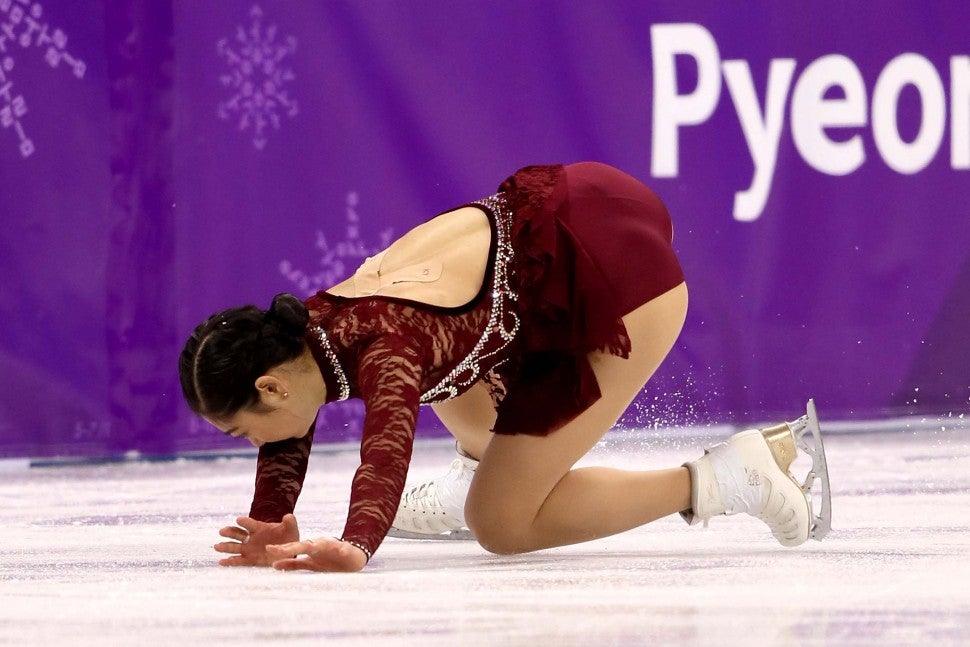 U.S. figure skater Mirai Nagasu falls during the women's short program at the 2018 Winter Olympics