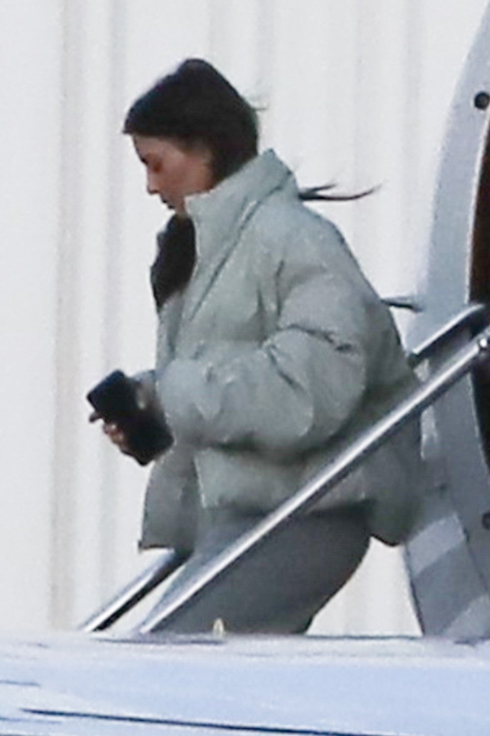 Kim Kardashian steps off a plane in Van Nuys, CA after Khloe Kardashian gave birth in Cleveland