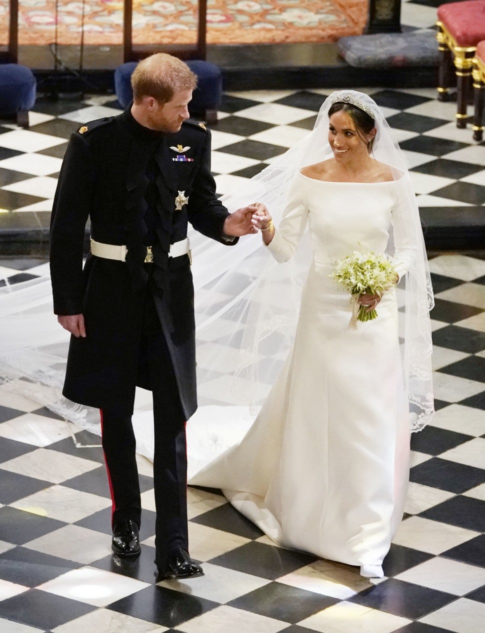 Prince Harry and Meghan Markle walk down the aisle as husband and wife