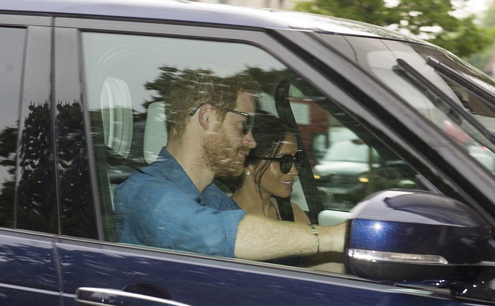 Prince Harry and Meghan Markle return to Kensington following royal wedding weekend