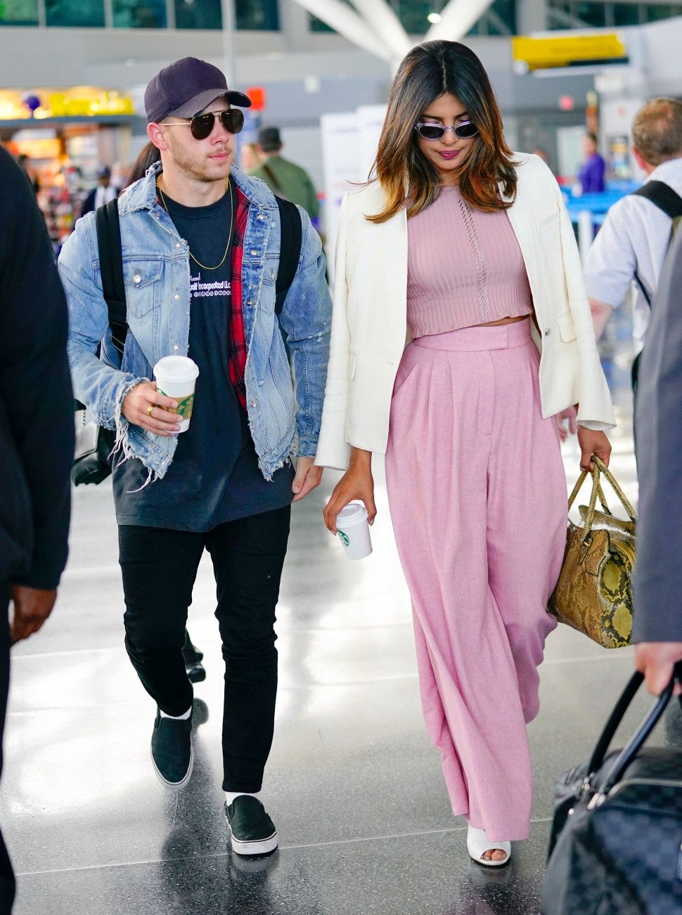 Priyanka Chopra in airport pink outfit with Nick Jonas
