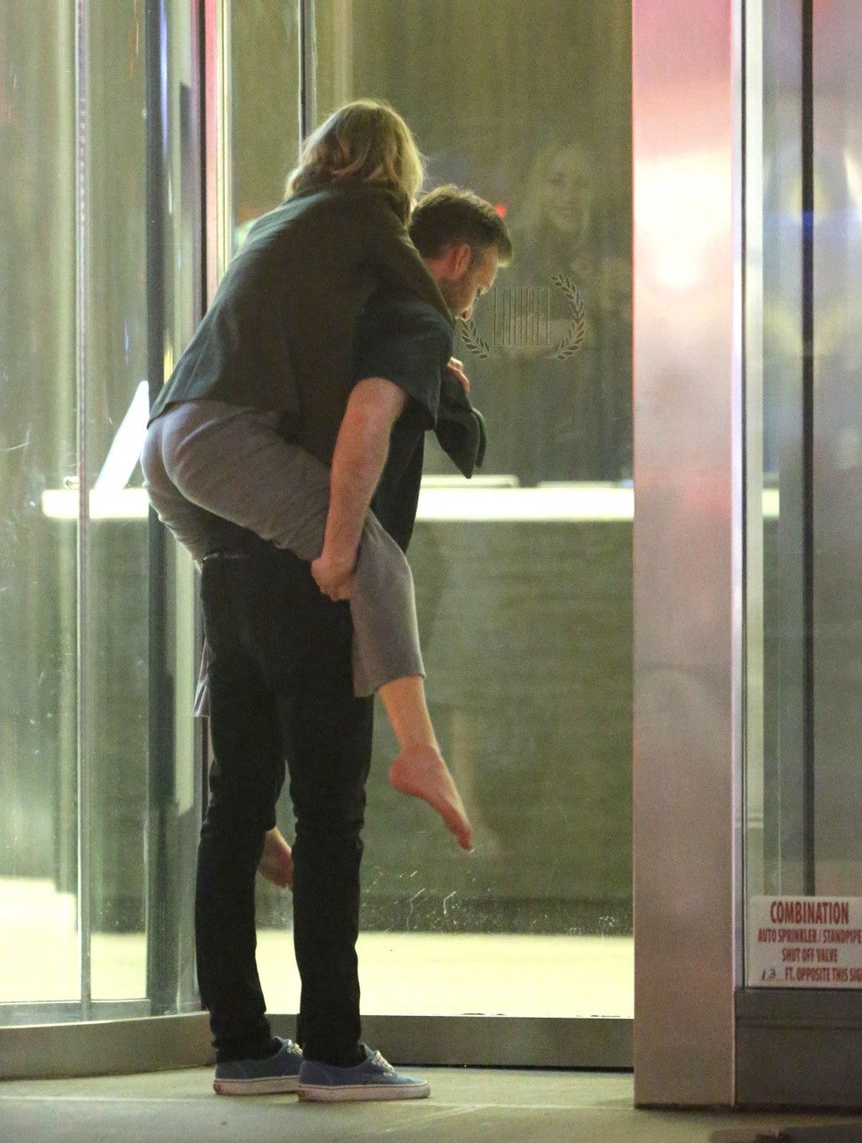 Jennifer Lawrence gets carried home late at night on the back of her rumored boyfriend Cooke Maroney in New York City. 