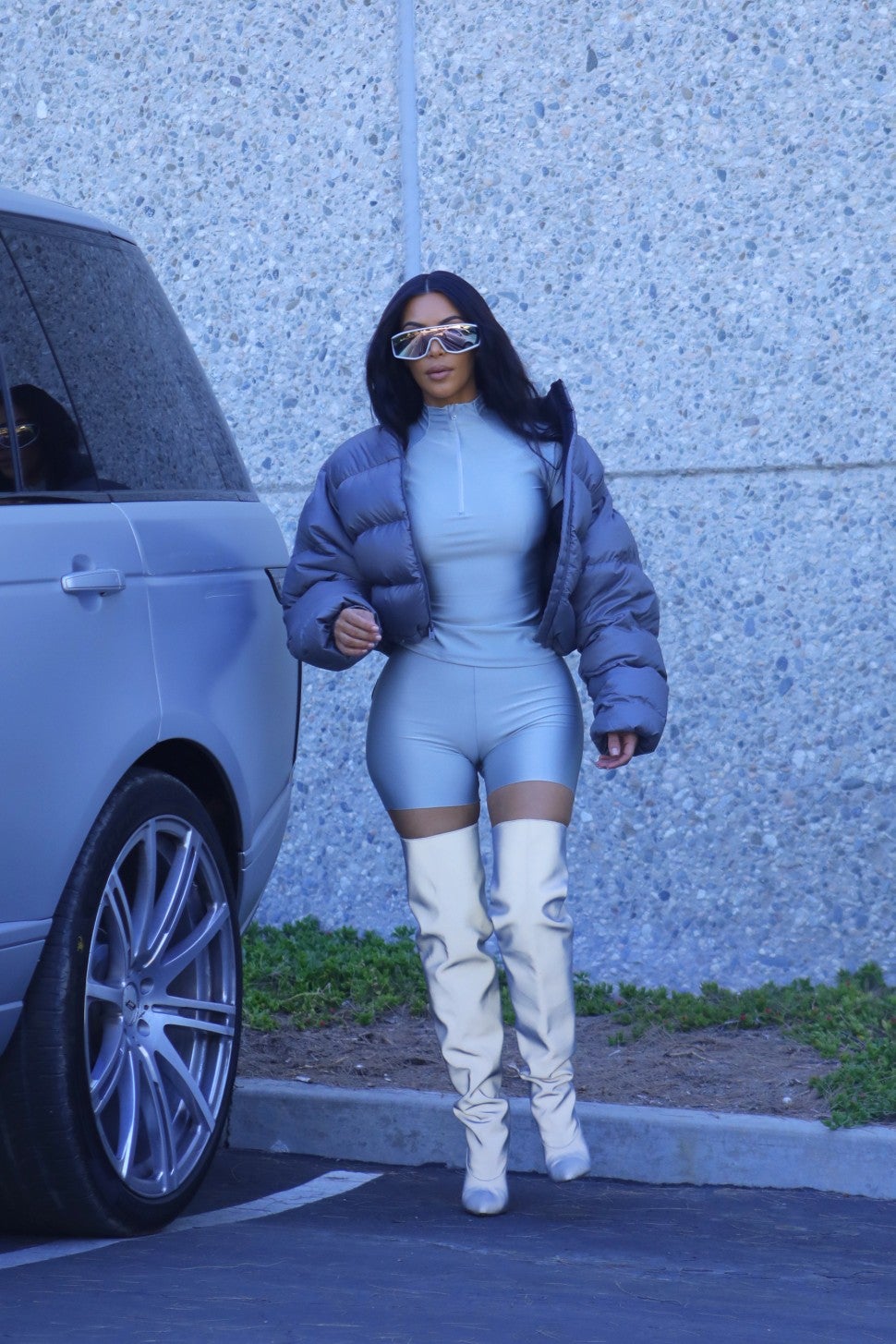 Kim Kardashian in Puffer Jacket and Metallic Boots